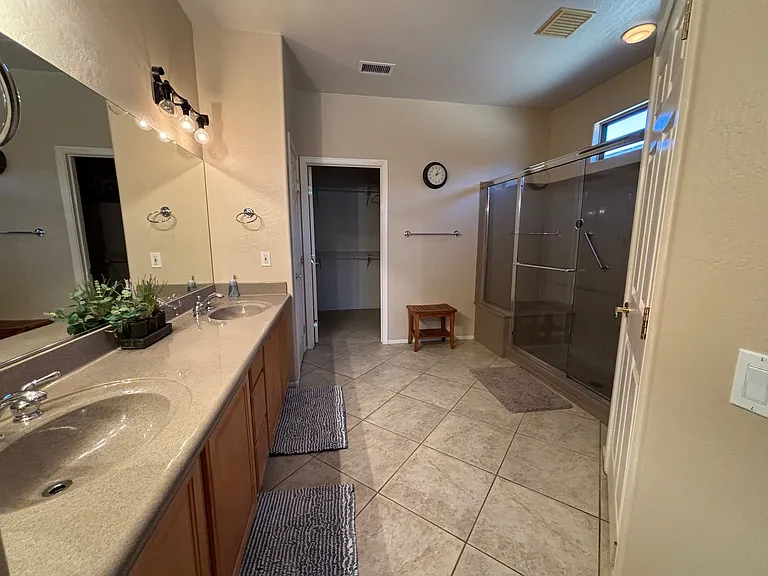 Primary Bathroom with walk in shower and dual sinks