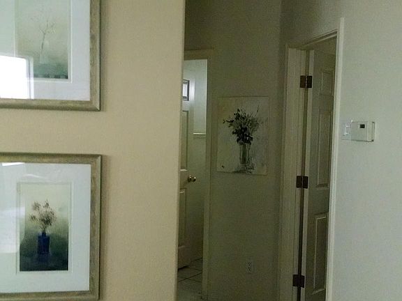 hallway to the 2 smaller bedrooms with bathroom in the middl