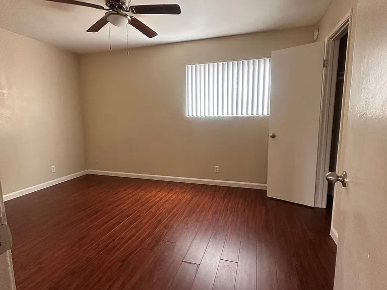 Ceiling fan and hardwood floors at The Meadowlark Apartments in San Marcos, CA.