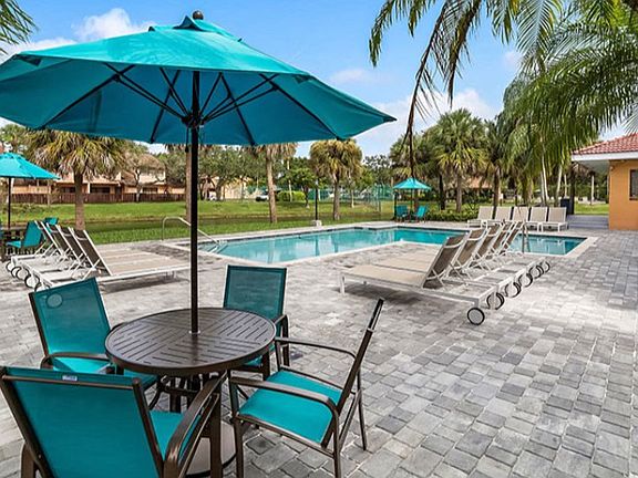 Enjoy the sparkling swimming pool and spacious sundeck at Midora at Woodmont