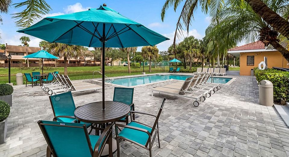 Enjoy the sparkling swimming pool and spacious sundeck at Midora at Woodmont