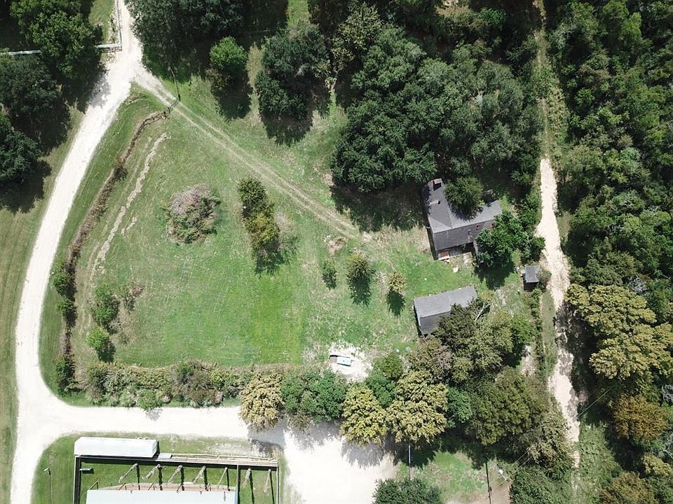Gravel road on the left side of the picture is how you access the front of the property.