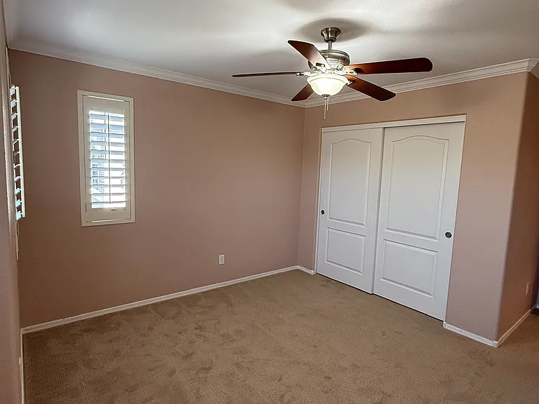 Charming bedroom with abundant natural light, and generous closet space.
