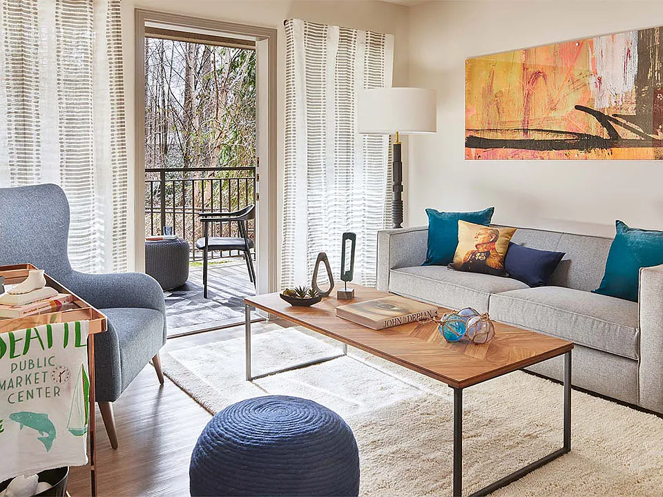 Apartment Living Room with wood flooring and balcony.