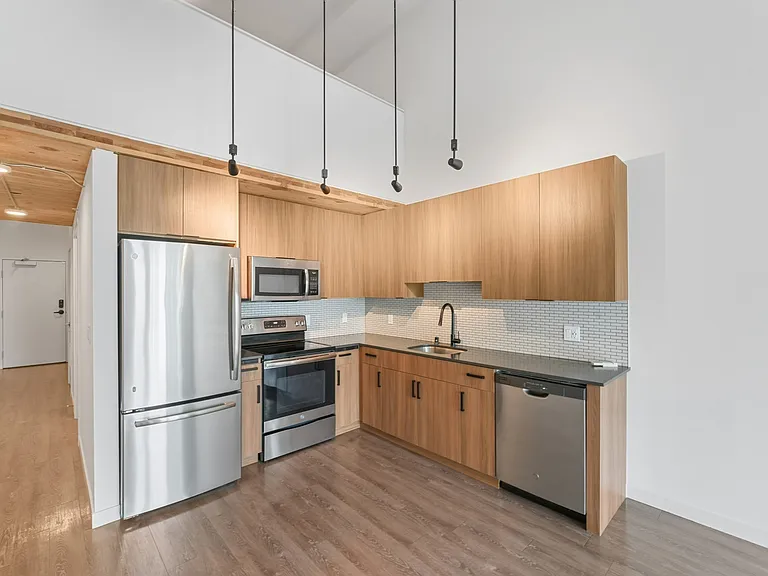 Sleek surfaces, smart storage, and modern finishes make this kitchen as functional as it is stylish.