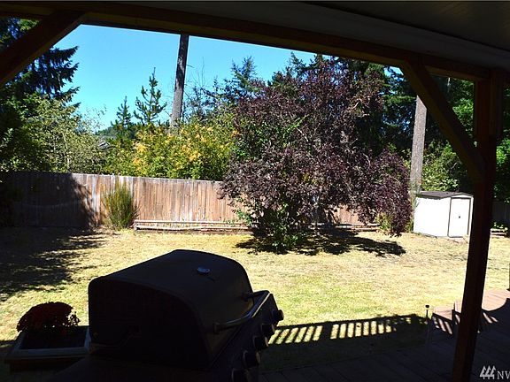 Nice backyard, view from covered deck. Greenbelt in back.