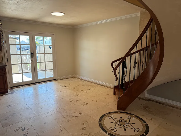 Dining table area and doors to back porch.