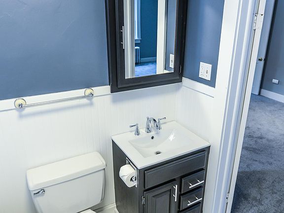 Remodeled bathroom with large claw foot tub.