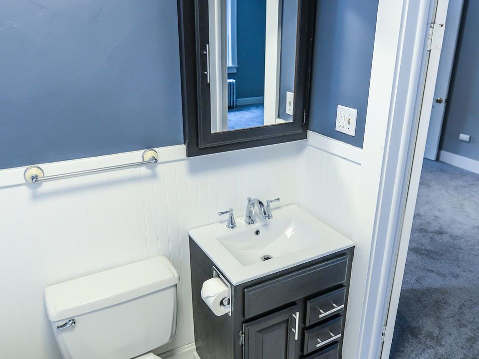 Remodeled bathroom with large claw foot tub.