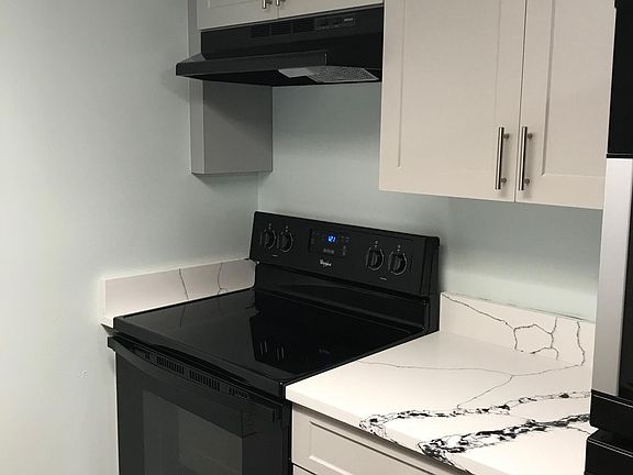 Granite counter top and new cabinets (fridge is to the right)