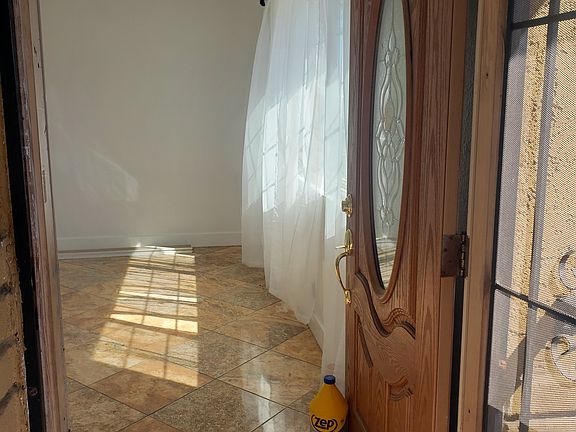 The enterance with security screen door.