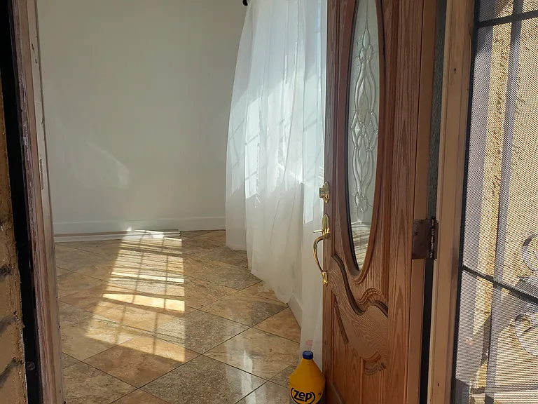 The enterance with security screen door.
