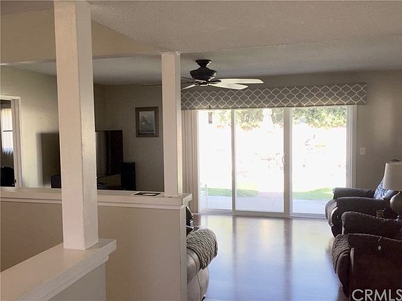 Living Room w/Large Sliding Door - Ceiling Fan