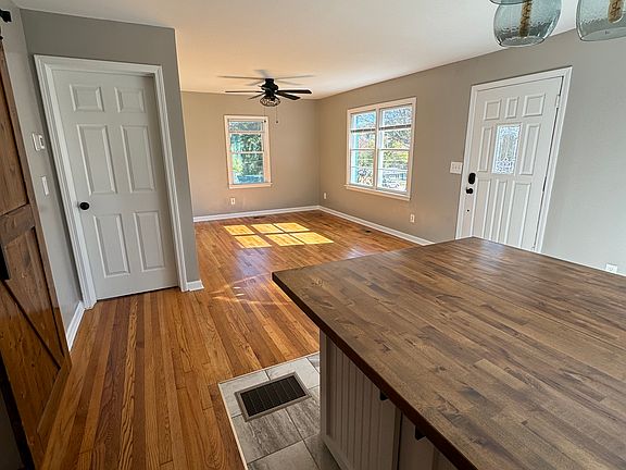 Gleaming hardwood floors and large windows let in abundant natural light, making this room the perfect gathering space for family and friends.