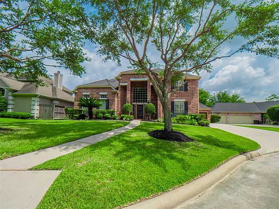 Located on a cul-de-sac street, mature landscaping and elegant trees.