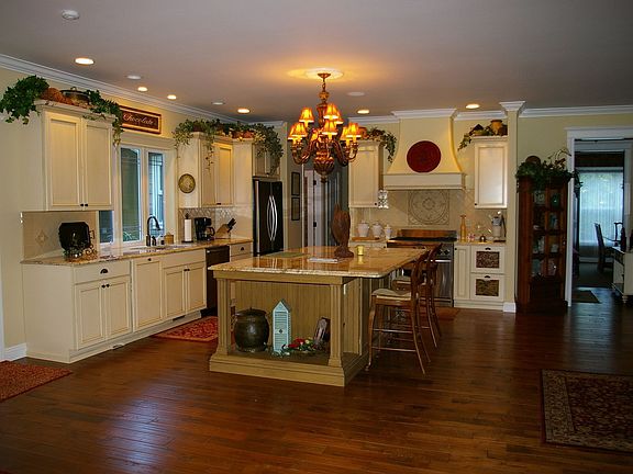 Extensive handscraped wood flooring