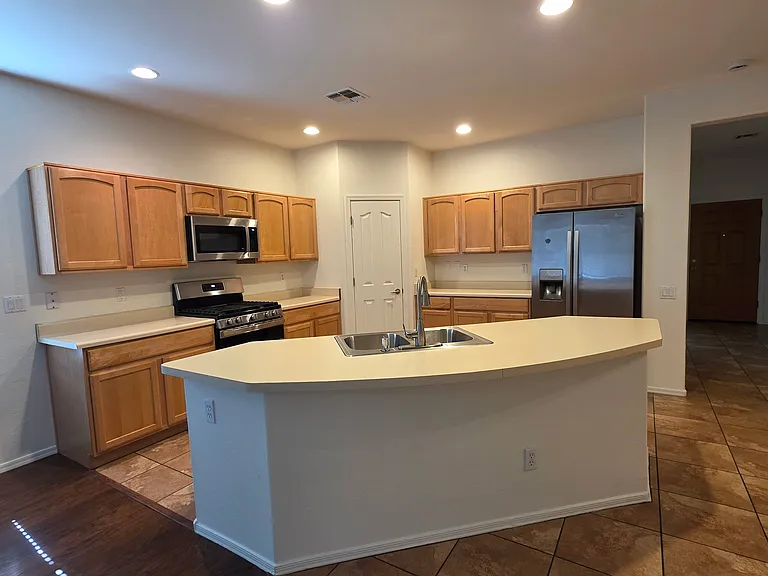 Kitchen with brand new Gas range, Brand new Microwave, brand new Dishwasher and refrigerator.