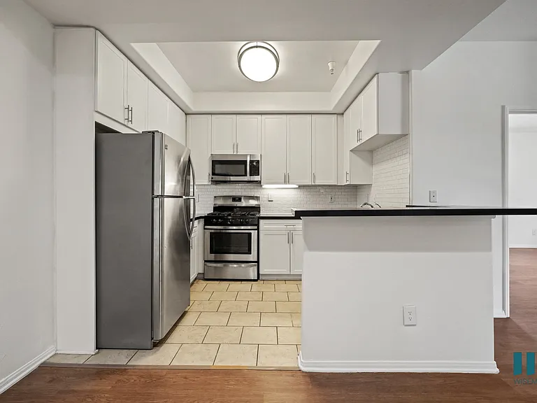 Kitchen with Stainless-Steel Refrigerator, Stove, Microwave Oven, and Dishwasher