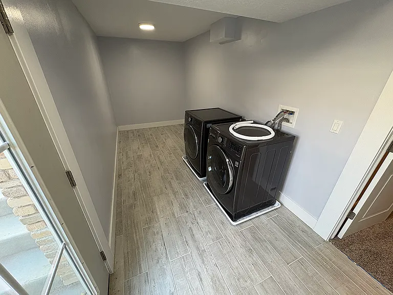 Separate mudroom and laundry room at entrance