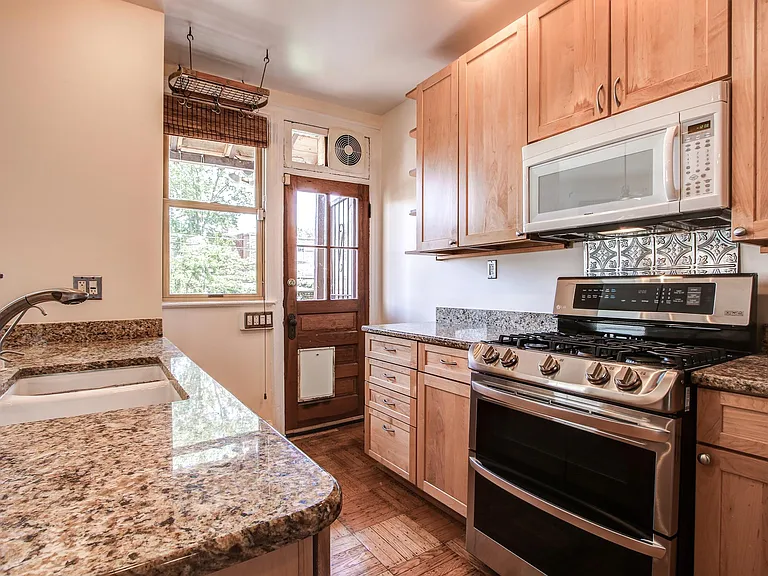 Kitchen, backdoor with dog door leading to backyard