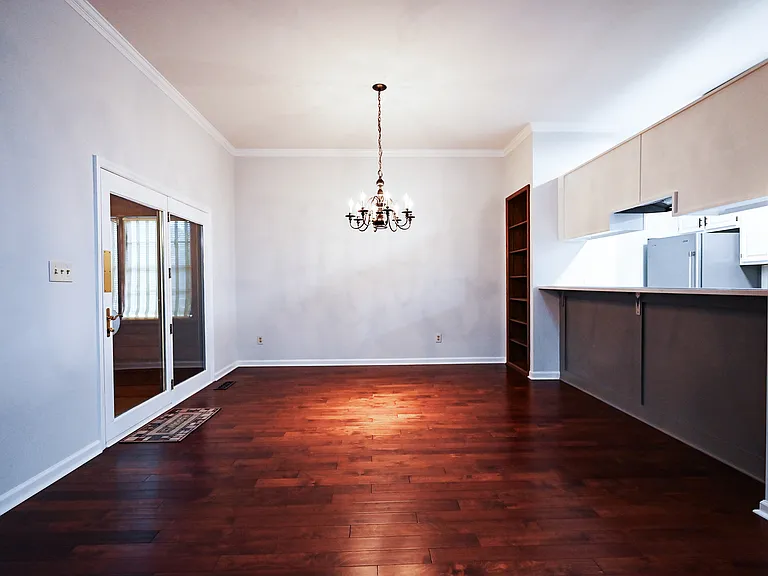 Dining room area with bar opens to sunroom.