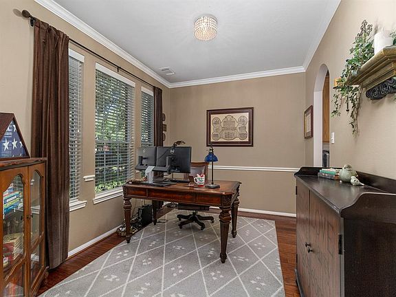 Formal dining room space is currently being used as a home office but has plenty of space for those formal dinners.