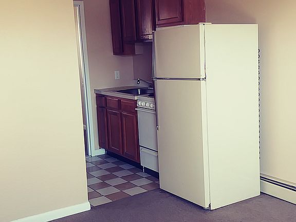 convenient kitchen with full size refrigerator