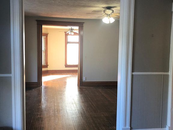 Standing in dinning room looking at living room and family r