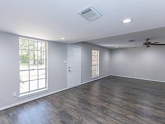 Flanking the front door, these two large windows really enhance the space and bring in a lot of light.