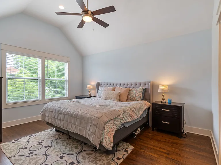 The spacious primary bedroom features vaulted ceilings and plenty of natural light.