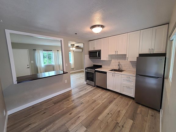fully renovated kitchen with new stainless steel appliances