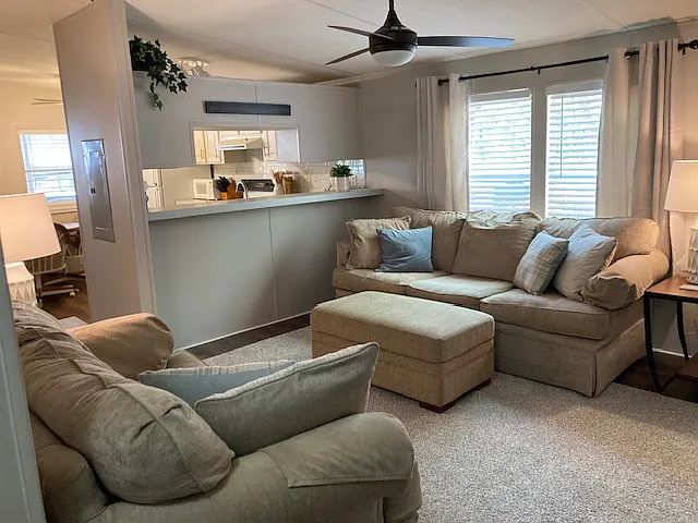 NOTE that this property is NOT furnished. This photo shows that a full size and loveseat couch both can fit comfortably in the living room area.