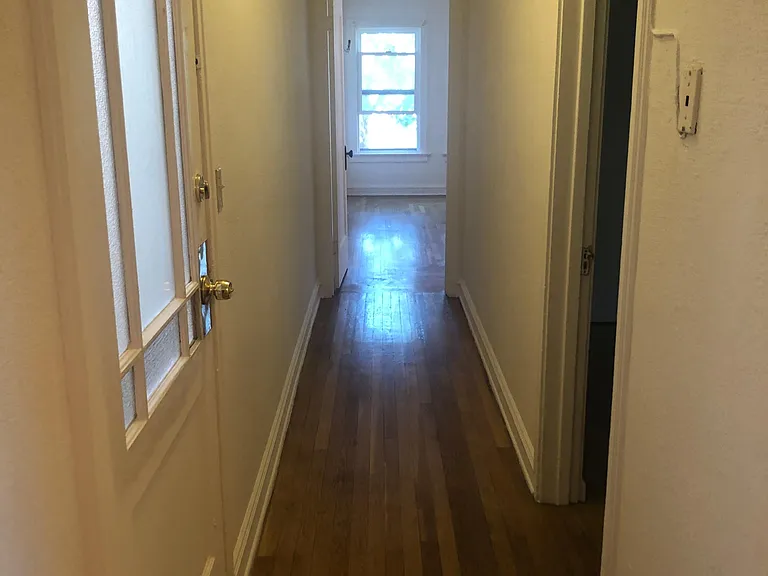 Different angle of hallway going towards studio room