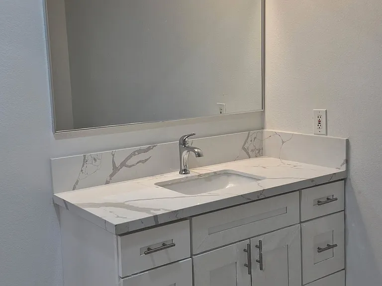 New vanity with quartz countertop.