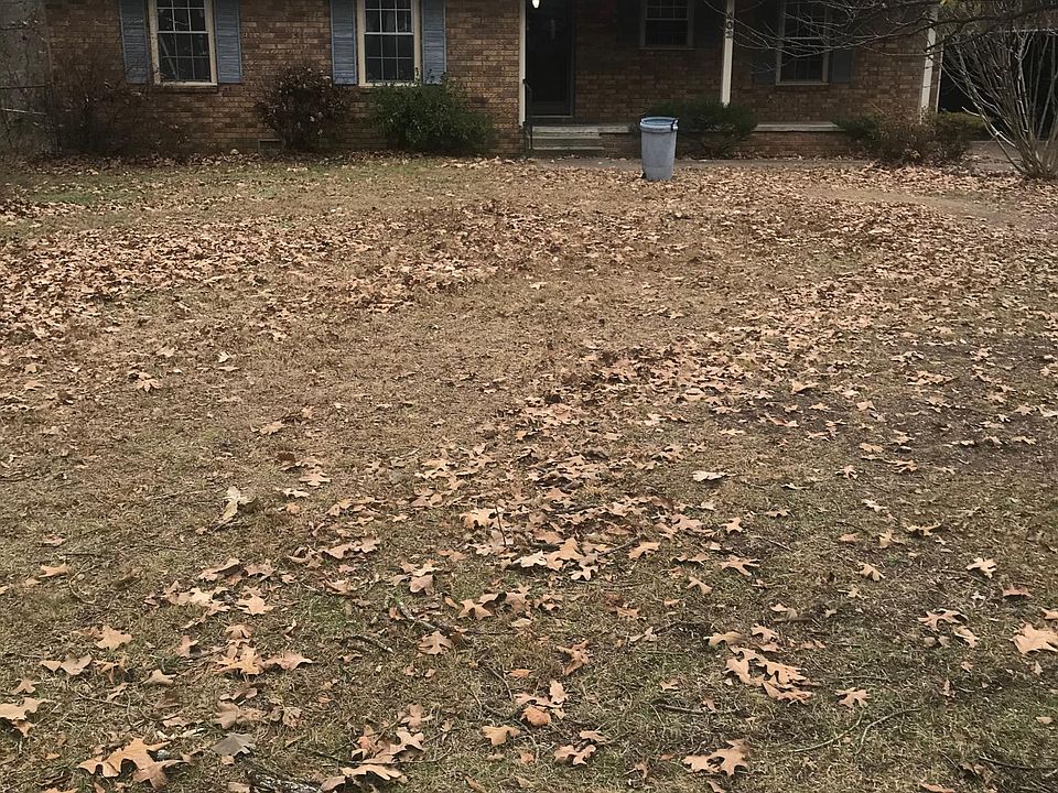 House sets back 100 feet from the street with mature oak trees