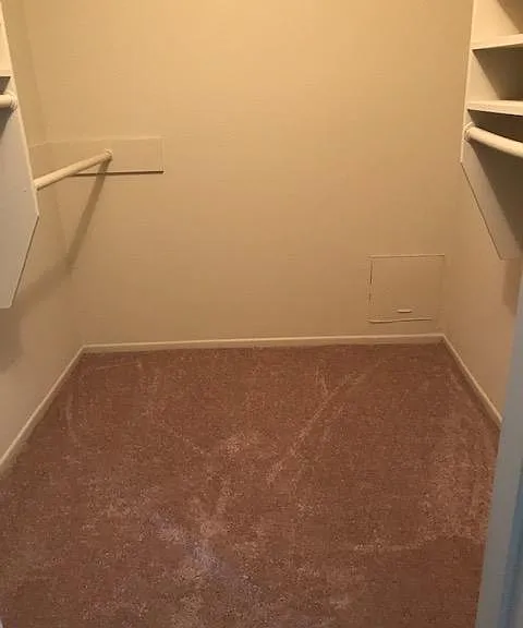 Second of the two master walk-in closets.