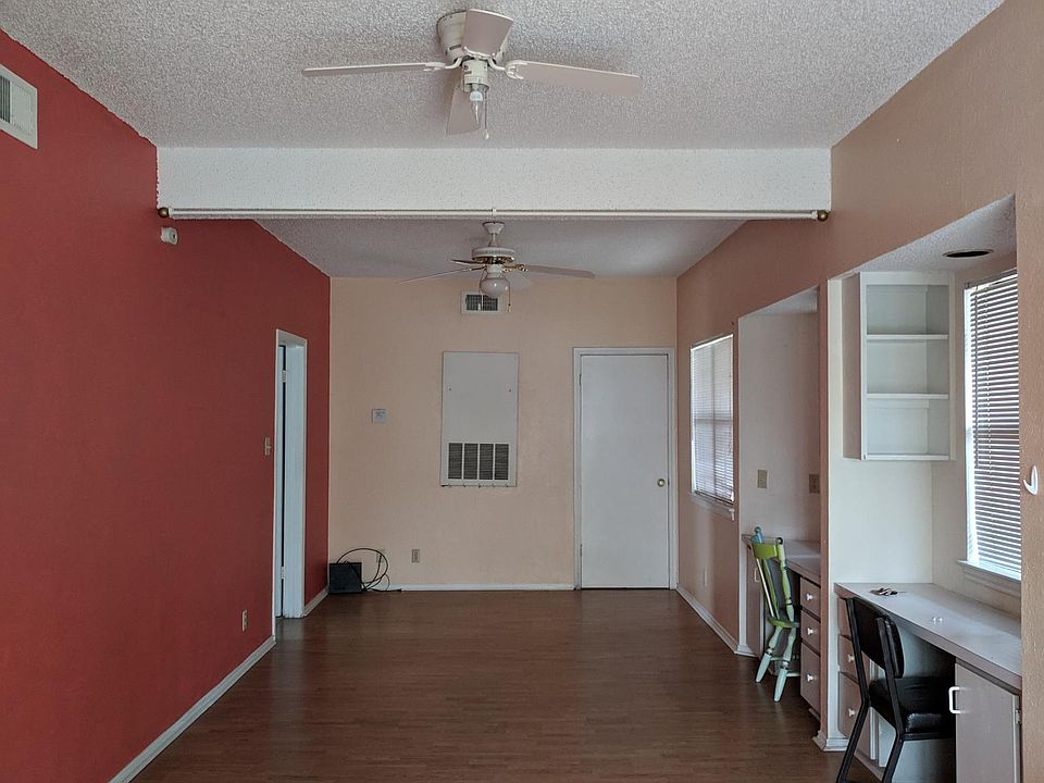 Living room with 2 built-in study desks and shelves