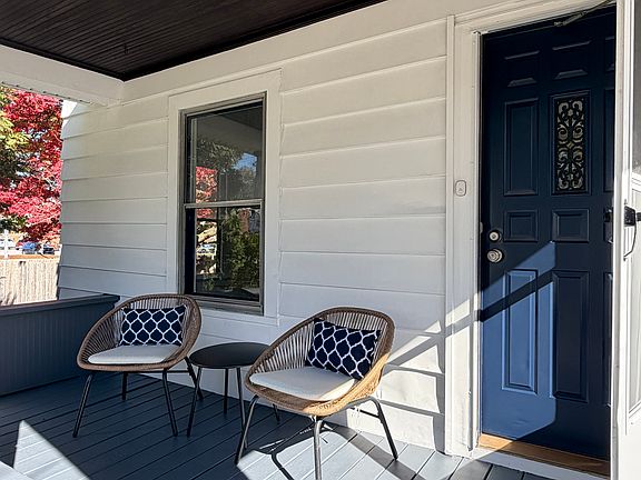 Covered front porch newly painted is wonderful for relaxing