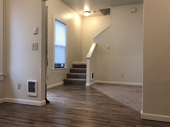 Stairs from living room to (2) upstairs bedrooms