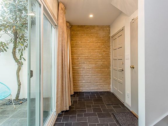 The entrance way has slate flooring, access to the atruim ar