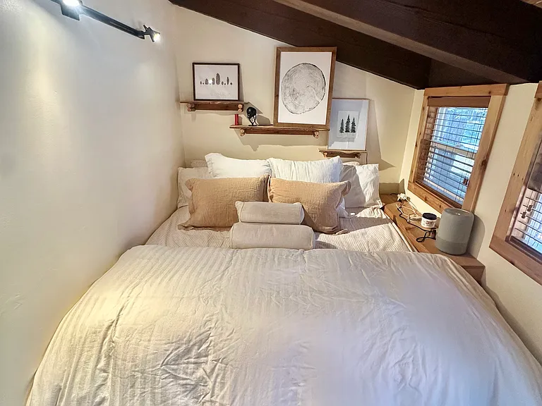 Bedroom 1. California King Bed. 
There is a door that leads out to a deck off the front of the Cabin.
