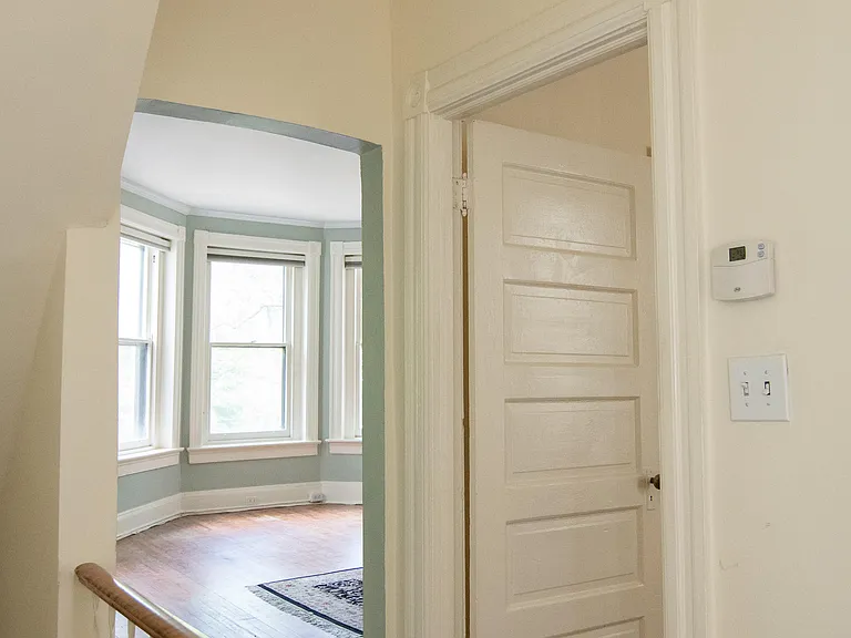 Entry to living room and bedroom 2. Old paint colors.