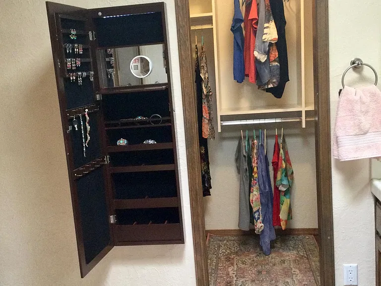 The walk-in closet in the master suite...
The jewelry cabinet closes to a long mirror.