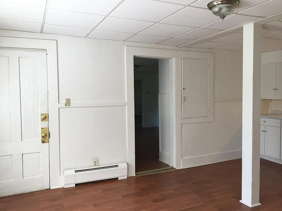 Eat in kitchen. Left door is main entrance into the apartment.
The other opening goes into the living room.