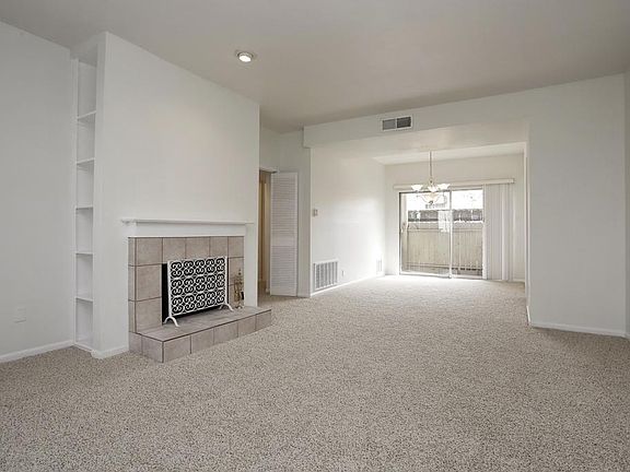 THE FABULOUS FLOW OF THE OPEN-CONCEPT LIVING ROOM AND DINING ROOM AREA IS PERFECT FOR ENTERTAINING!