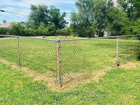 Fenced Back Yard with Driveway