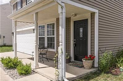 Covered front porch welcomes guests to linger