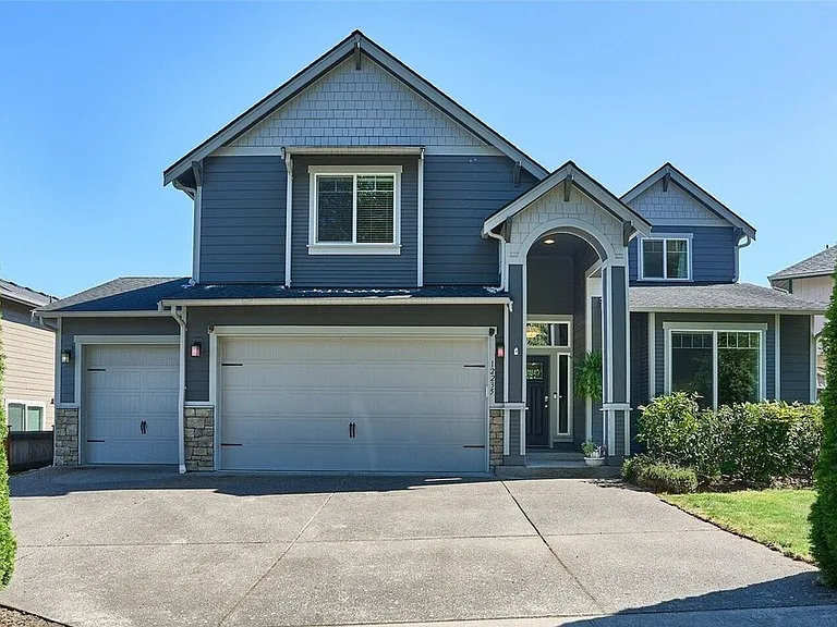 Beautiful home with three car garage and a huge drive way.