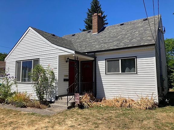 Separate entrances for main unit (listed here) and attic apartment (rented separately).