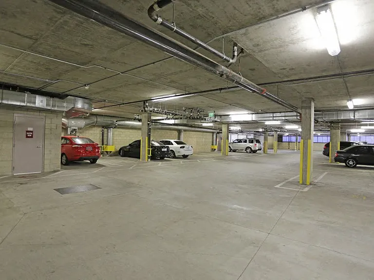Gated assigned parking at 12th Street Lofts in National City, California.